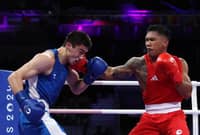 EUMIR Marcial (right) fails to neutralize the height and reach of Turabek Khabibullaev of Uzbekistan, leading to an early exit in the men’s 80-kilogram event of the Paris Olympics.